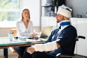 Disabled man with bandage on the head filing for personal injury claim.