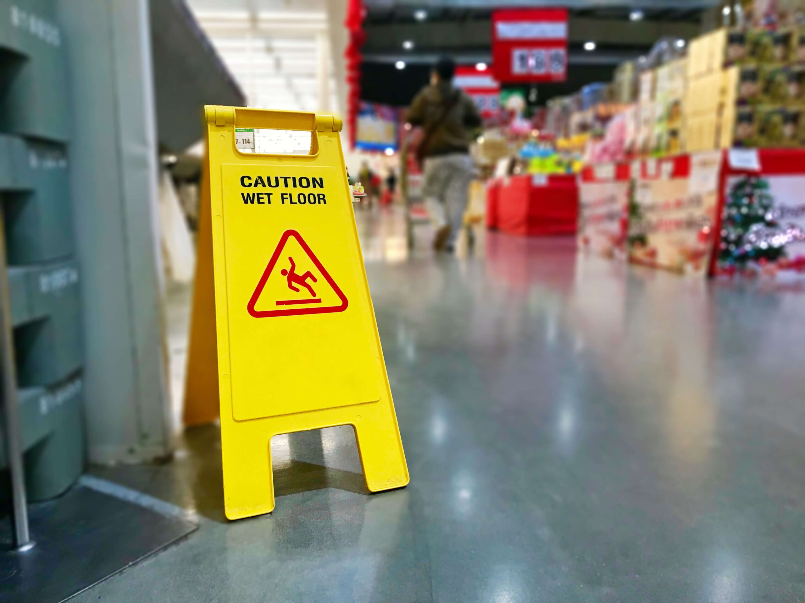 Caution wet floor sign in the supermarket.
