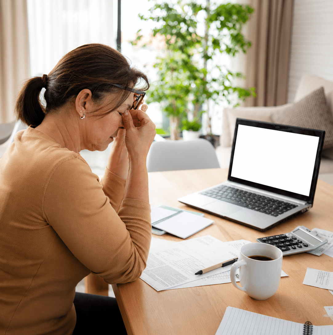 Woman having a headache at work